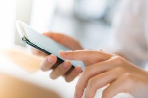 hand with mobile phone